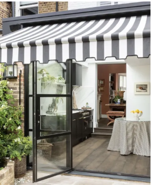 Striped awning over a courtyard door