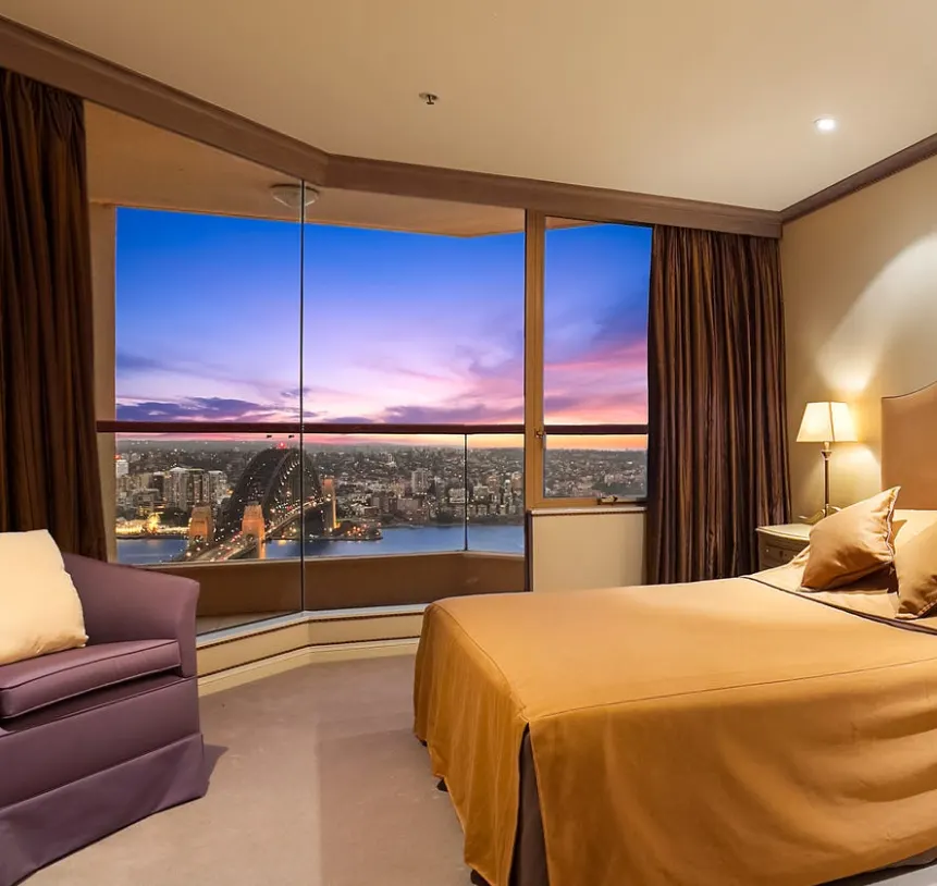 Pinch pleat blockout curtains in an apartment bedroom, Sydney CBD