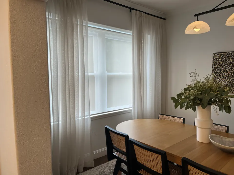 Sheer curtains and sheer roller blinds in a dining room, Double Bay