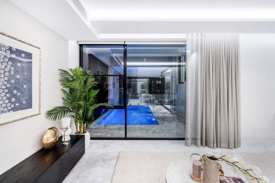Wave sheer curtains beside an indoor pool, Hurstville Grove
