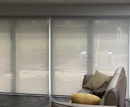 Light-filtering roller blinds in a living room