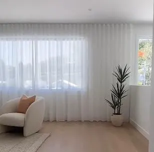 S-fold sheer curtains in a bright living room