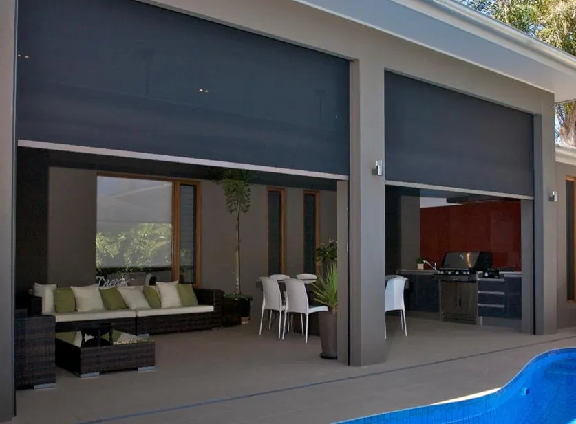 Outdoor zip screens shading a covered patio