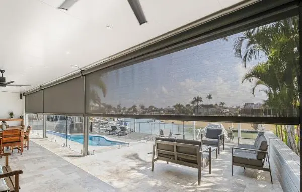 Zip screen lowered across a poolside alfresco